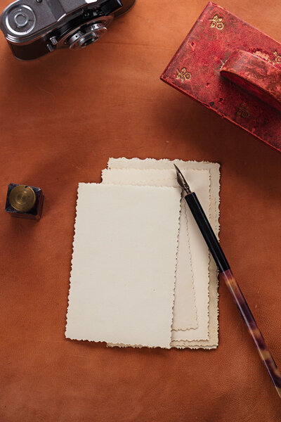 vintage red leather ink blotter  with retro post cards on leathe