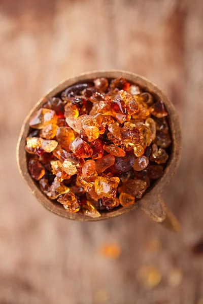 Gum arabic, also known as acacia gum - in bowl — Stock Photo, Image