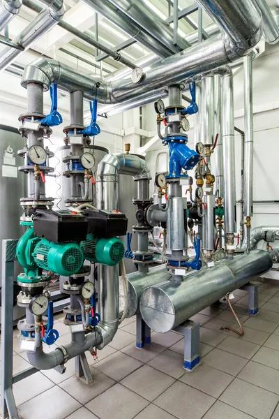 Interior gas boiler room with multiple pumps and piping — Stock Photo, Image