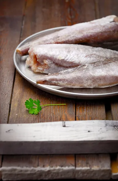 Cooking from frozen: frozen fish on a tray — Stock Photo, Image