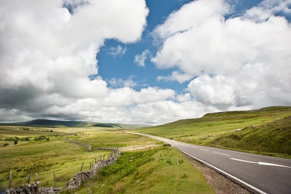 Countryside landscape image across to mountains in distance with — Stock Photo, Image