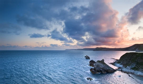 Sunrise ocean landscape Mupe Bay Jurassic Coast England — Stock Photo, Image