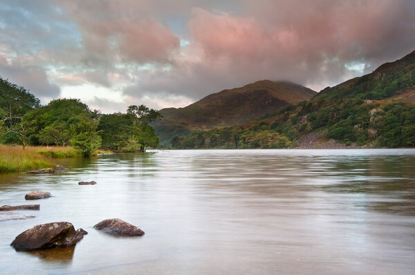 Sunrise landscape over Llyn Gwynant to Yr Afan mountain in Snowd