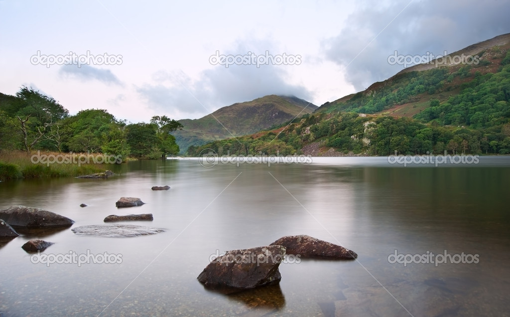 Sunrise landscape over Llyn Gwynant to Yr Afan mountain in Snowd