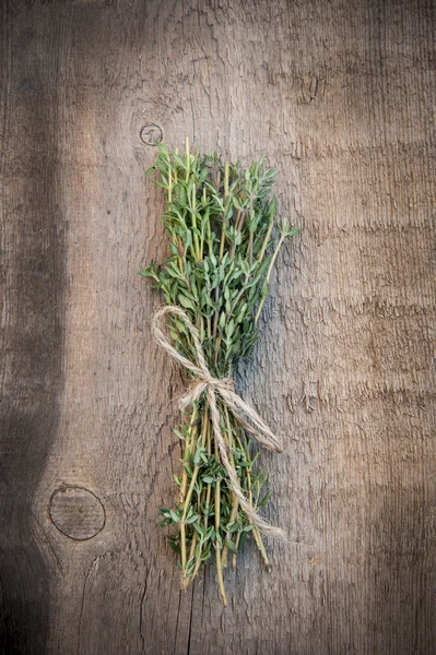 Fresh thyme on vintage wooden board — Stock Photo, Image