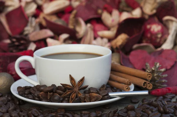 Steaming hot cup of coffee on Christmas background — Stock Photo, Image