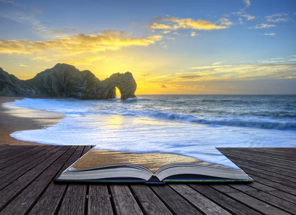 Vibrant sunrise over ocean with rock stack in foreground in page — Stockfoto