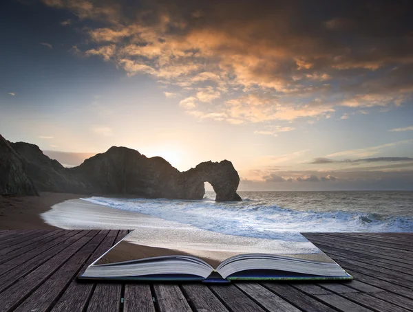 Vibrant sunrise over ocean with rock stack in foreground in page — Stockfoto