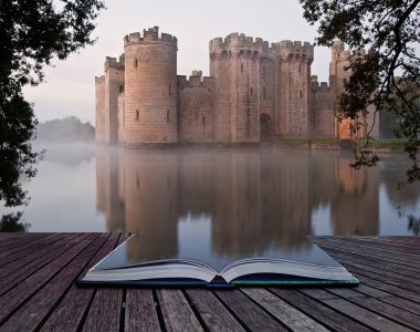 Stunning moat and castle in Autumn Fall sunrise with mist over m clipart