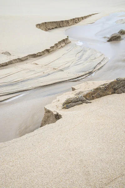 Detalhe da praia de areia amarela — Fotografia de Stock