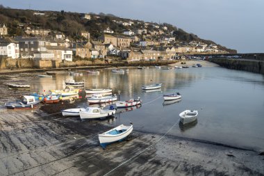 A traditional Cornish fishing village and harbor Cornwall England clipart