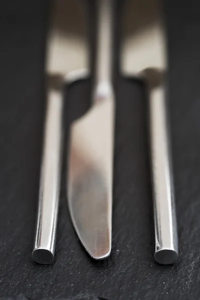 Macro imagem de facas de talheres no fundo rústico — Fotografia de Stock
