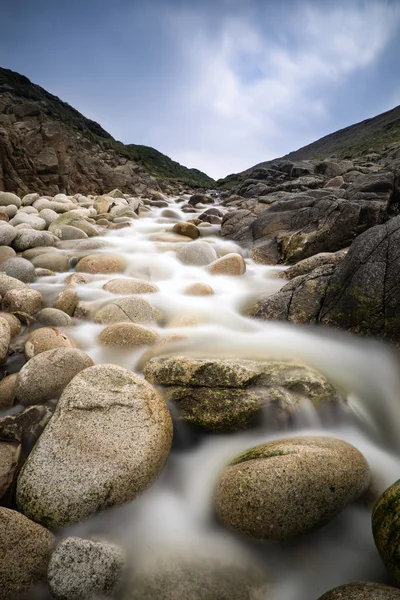 Stream feeding onto Porth Nanven beach Cornwall England — Stock Photo, Image