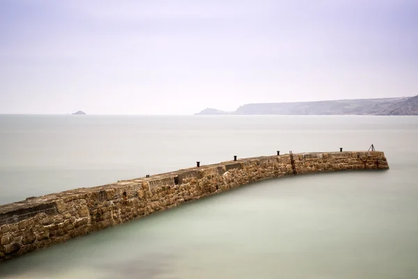 Sennen Cove harbour wall long exposure in Cornwall England — Stock Photo, Image