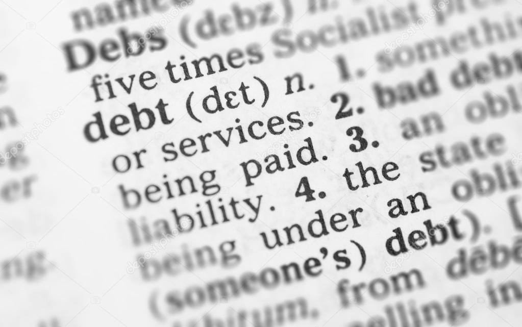 Macro image of dictionary definition of debt