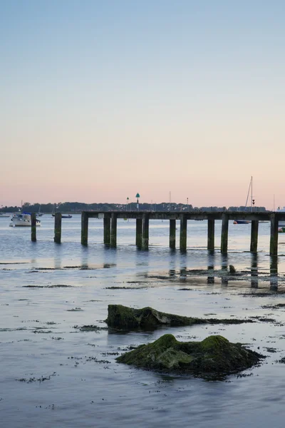 Late Summer evening landscape across harbor long exposure with j — Stock Photo, Image