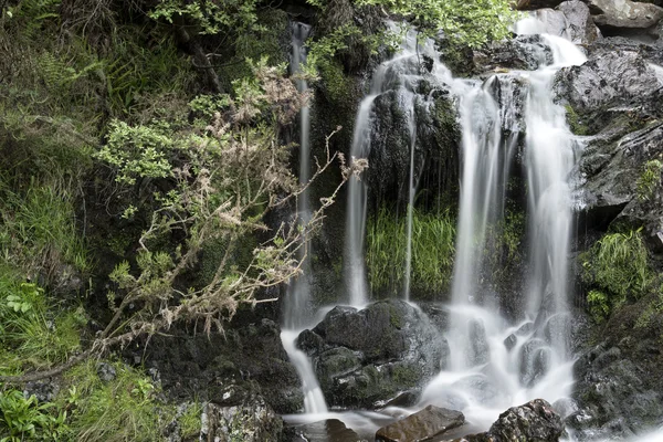 Landscape detail of waterfall over rocks in Summer long exposure — Stock Photo, Image