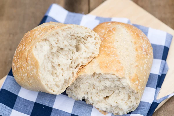 Loaf of sourdough bread in rustic kitchend setting — Stock Photo, Image