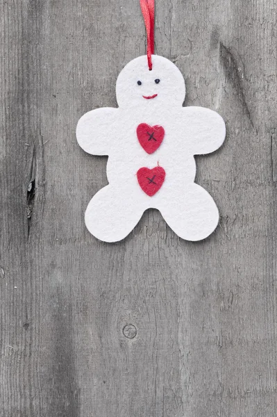 Generic machine made Christmas gingerbread man ornament on rusti — Stock Photo, Image