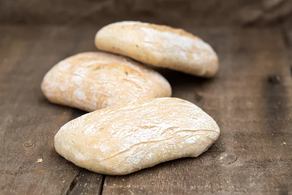 Panini rollos en cocina rústica con utensilios de cocina —  Fotos de Stock