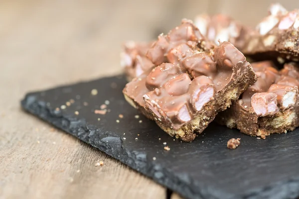 Rustic background with rocky road dessert squares — Stock Photo, Image