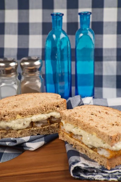 Fresh fish finger sandwich on wholegrain in rustic kitchen setti — Stock Photo, Image