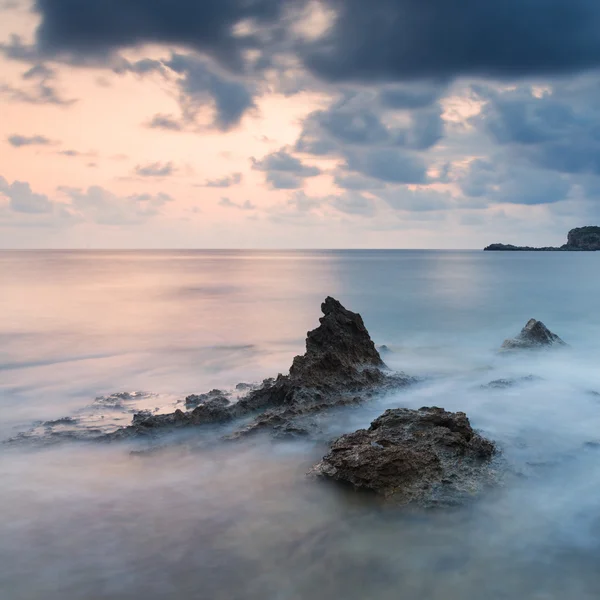 Stunning landscapedawn sunrise with rocky coastline and long exp — Stock Photo, Image