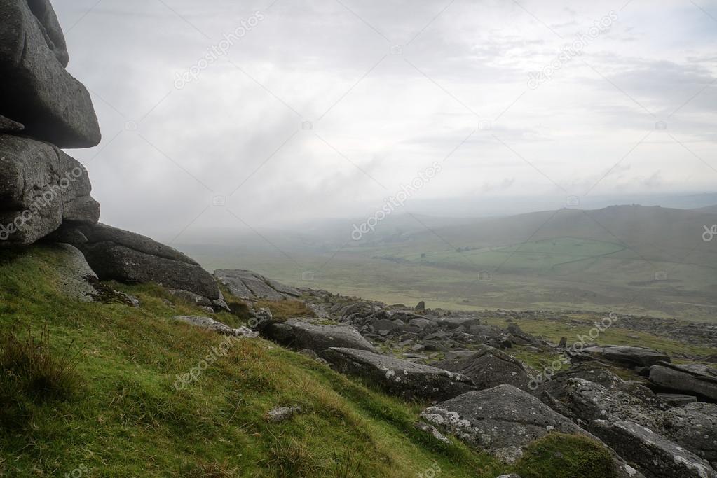 Landscape over Dartmoor National Park in Autumn with rocks and f