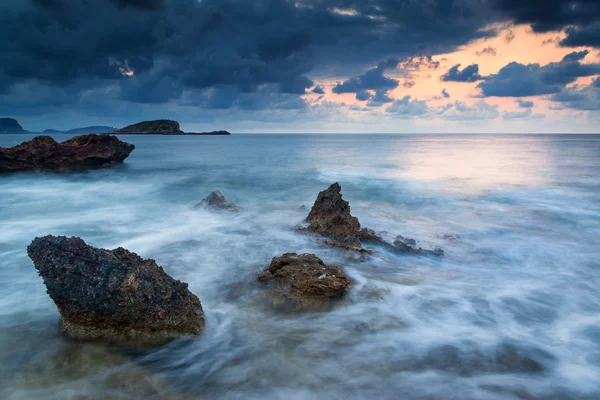 Stunning landscapedawn sunrise with rocky coastline and long exp — Stock Photo, Image