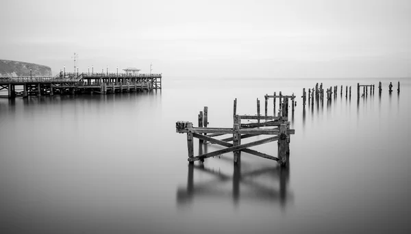 Beaux-arts landscape image of derelict pier in laitky long exposure — Photo