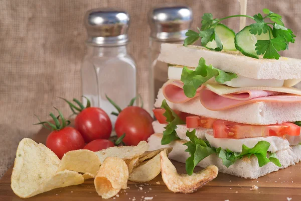 Fresh club sandwich in rustic kitchen setting — Stock Photo, Image