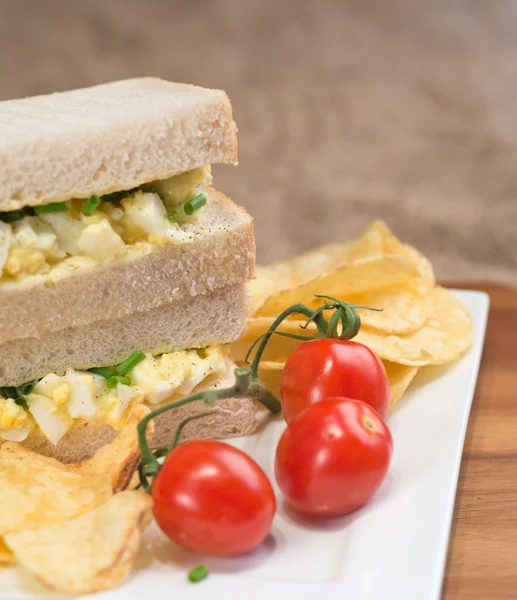 Fresh egg on white sandwich in rustic kitchen setting — Stock Photo, Image