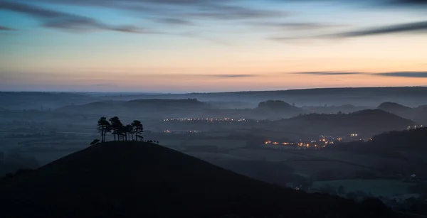 Beautiful sunrise dawn landscape of hills overlooking brightly l — Stock Photo, Image