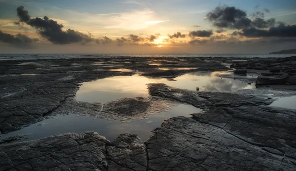 Beautiful seascape at sunset with dramatic clouds landscape imag