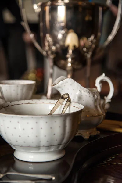 18th Century cups and saucers crockery on inlaid wooden serving — Stock Photo, Image