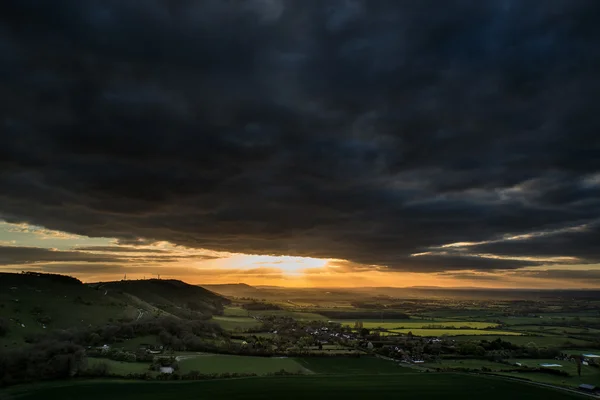 Stunning Summer sunset across countryside landscape with dramati — Stock Photo, Image