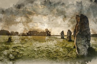 Digitally created watercolor painting of Beautiful Summer sunrise landscape of Neolithic standing stones in English countryside with gorgeous light with background mist clipart