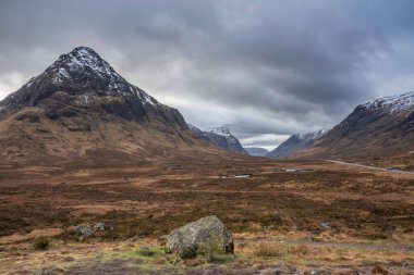 Beautiful Winter landscape looking across Rannoch Moor in Scottish Highlands towards Buachaille Etive Mor Stob Dearg snowcapped peak
