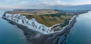 Beautiful Summer sunrise landscape image of Beachy Head Lighthouse in South Downs National Park in England