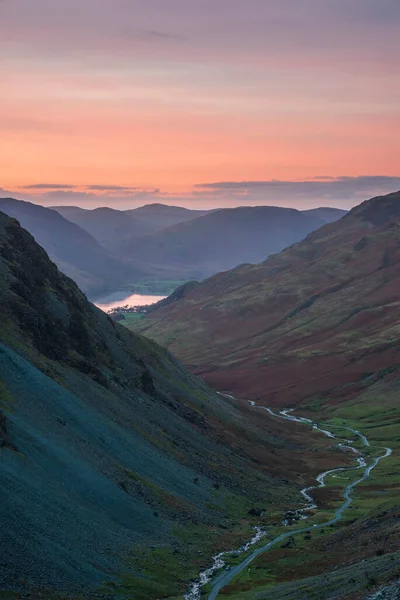 Epic landscape image of view down Honister Pass to Buttermere from Dale Head in Lake District during Autumn sunset