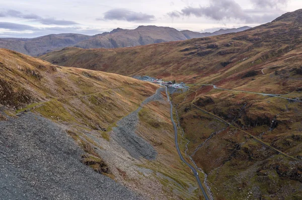 Epic landscape image of view down Honister Pass to Buttermere from Dale Head in Lake District during Autumn sunset