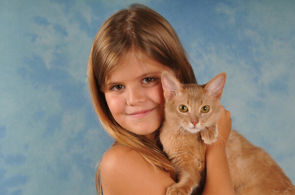 Lovely portrait of girl with kitten