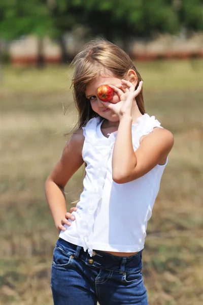 Girl with apple — Stock Photo, Image