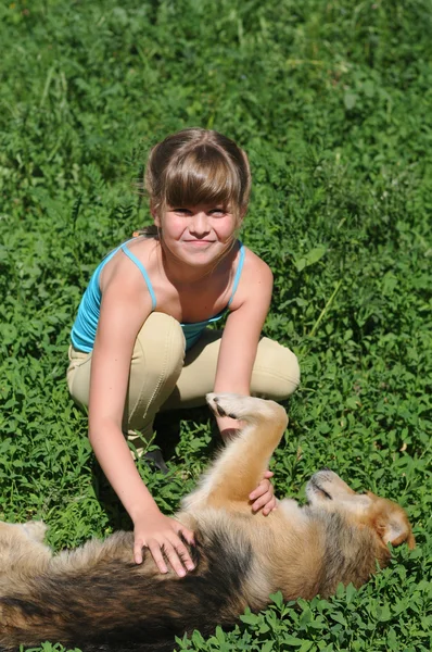 Girl with lying dog — Stock Photo, Image