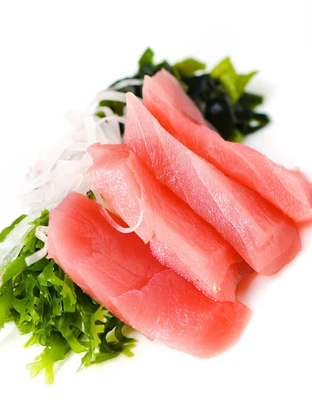 Pieces of tuna and salad on white — Stock Photo, Image