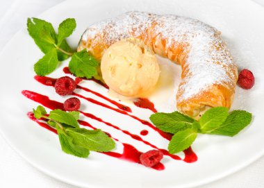 Strudel with ice cream decorated with mint leaves