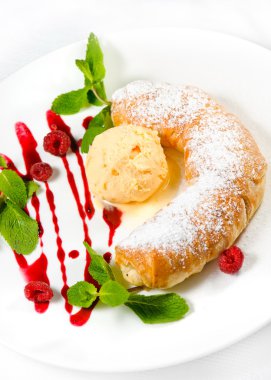 Strudel with ice cream decorated with mint leaves