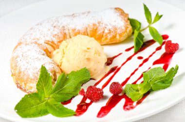 Strudel with ice cream decorated with mint leaves