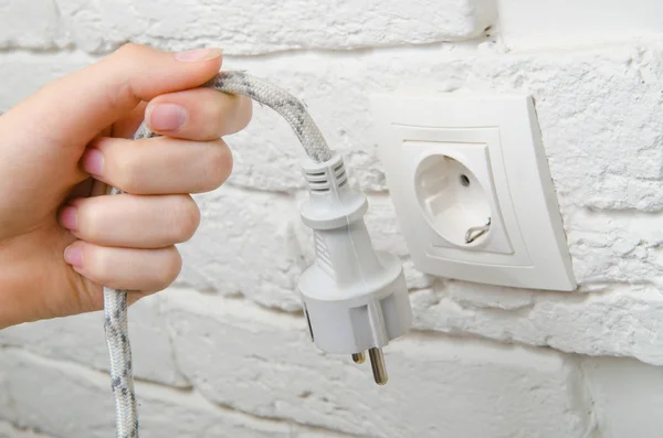 Plug the wire into the socket — Stock Photo, Image