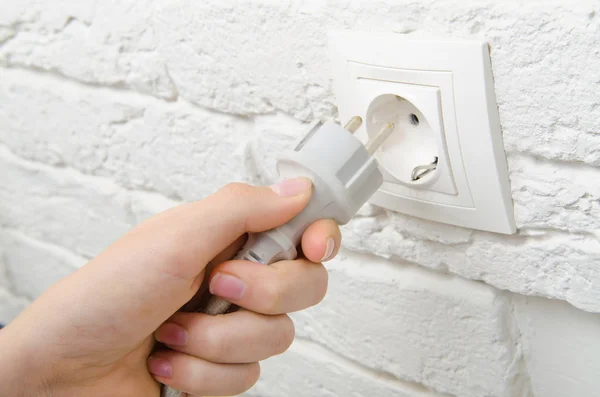 Plug the wire into the socket — Stock Photo, Image